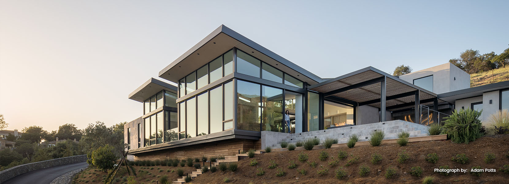 Hillside Texas residence with expansive window package overlooking the Hill Country — Ironwood